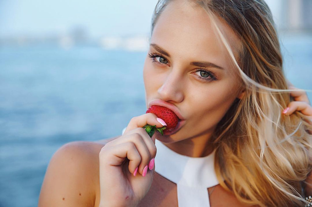 Anna Dovgalyuk eating a strawberry
