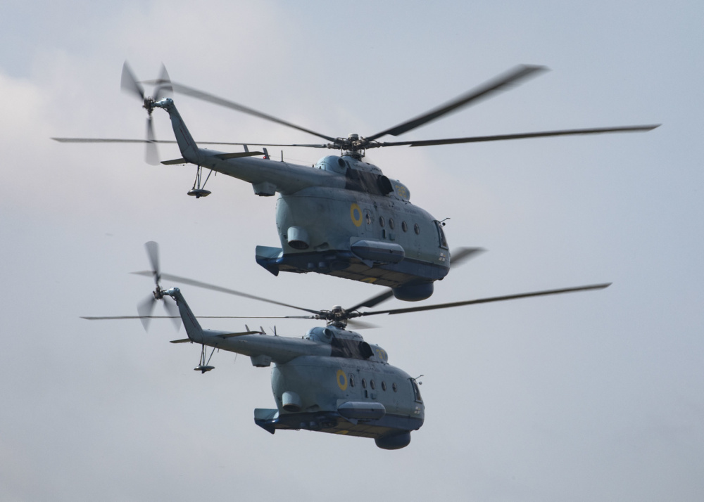 210630-N-BM428-0247 MYKOLAIV MILITARY AIRBASE, Ukraine (June 30, 2021) Two Ukrainian Mi-8 helicopters fly in formation during an air demonstration portion of Exercise Sea Breeze 2021 on Mykolaiv Military Airbase, Ukraine, June 30, 2021. Exercise Sea Breeze is a multinational maritime exercise cohosted by the U.S. Sixth Fleet and the Ukrainian Navy since 1997. Sea Breeze 2021 is designed to enhance interoperability of participating nations and strengthens maritime security and peace in the region. (U.S. Navy photo by Mass Communications Specialist 2nd Class Damon Grosvenor/Released)