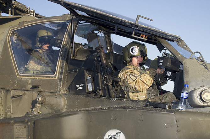 U.S. Army pilots from the 3rd Combat Aviation Brigade power down an AH-64 Apache helicopter at Forward Operating Base Dahlke, Afghanistan, May 18, 2016. The 40th Combat Aviation Brigade sent Soldiers, aircraft and equipment to FOB Dahlke in May to support the garrison’s mission to train, advise and assist the Afghan National Army. (U.S. Army Photo by Staff Sgt. Ian M. Kummer, 40th Combat Aviation Brigade Public Affairs)