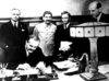 Signing of the Germano-Soviet Non-Agression Pact in Moscow. Molotov signs. Behind him, Ribbentrop and Stalin Signing of the Germano-Soviet Non-Agression Pact in Moscow. Molotov signs. Behind him, Ribbentrop and Stalin
